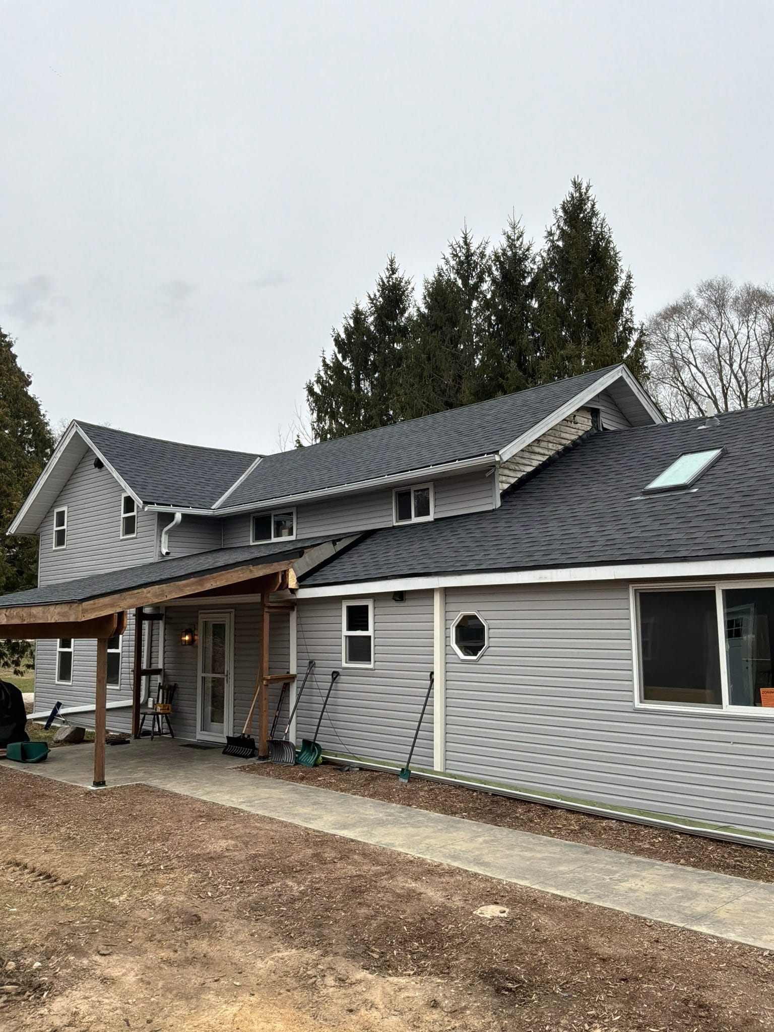 Residential Sullivan house with new architectural shingles and clean roofline